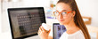 © shefkate - Young woman working in office, sitting at desk