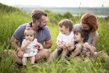 Happy family in the meadow