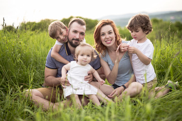 Happy family in the meadow