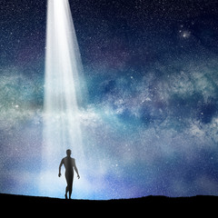 Wall Mural - silhouetted man and lights of universe