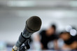 © sripfoto - Microphone on the abstract blurred photo of seminar room background