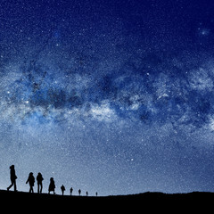 silhouetted people and lights of universe