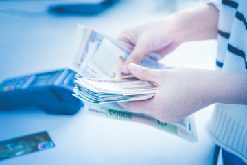 Wall Mural - cash and card payment with chip and pin machine in shop.