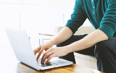 Wall Mural - Man on a laptop in bright room