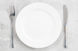 © cook_inspire - concept photo. White empty plate and cutlery, closeup