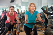 © caftor - vigorous females of different age training on exercise bikes