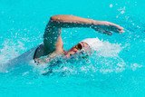 Fototapeta Łazienka - Female swimmer on training in the swimming pool