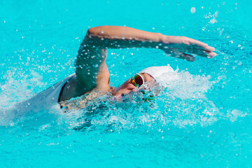 Wall Mural - Female swimmer on training in the swimming pool