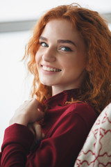 Poster - Close up portrait of a smiling young redheaded woman