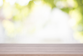 Wall Mural - Wood table top on green bokeh background for product display montage.