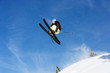 © Connect Images - Male skier jumping mid air on mountain