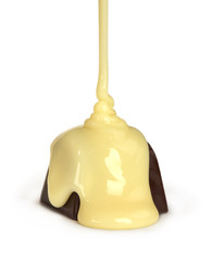 sweet milk pouring on chocolate candy isolated