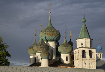 Wall Mural - domes of the church against dramatic cloudy sky