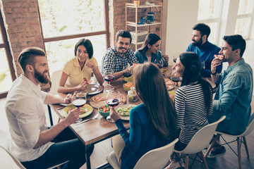 Canvas Print - Friend`s gathering for feast. Cheerful youth is having tasty food and wine at the indoor party. So many emotions and memories to share!