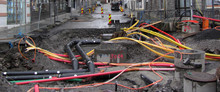 Repair Of Communications. Water Supply, Sewerage Electrician. Excavated Road In The City.