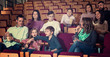 © JackF - Number of people enjoying film screening and popcorn