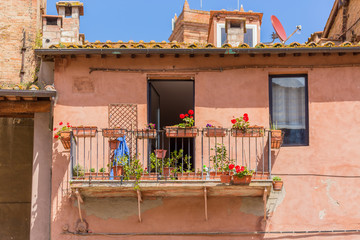 Poster - Balcony with red flowers in window boxes