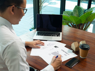 young business man signing contract