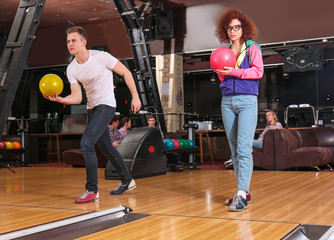 Wall Mural - Friends having fun and playing bowling