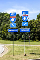 Two signs at interstate 40 in Tennesse. West to Nashville and East to Knoxville