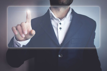 Canvas Print - man touching display.
