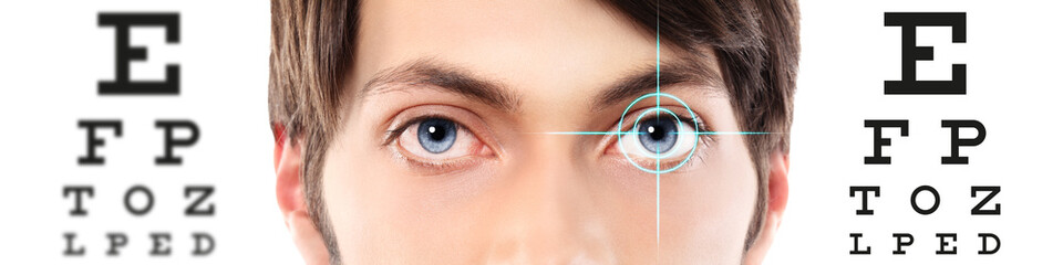 eyes close up on visual test chart, eyesight and eye examination concept in white background