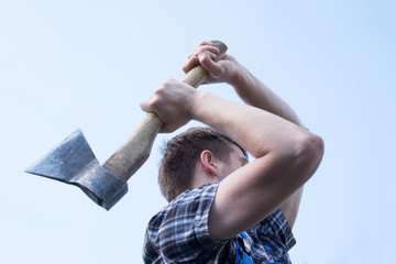 Portrait of confident man working with axe