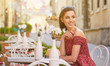 © ZoomTeam - woman having italian coffee at the cafe on the street in Toscana city. Soft focus with small depth of field