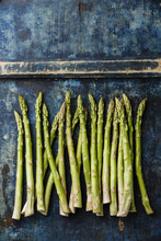 Fresh Raw Green Asparagus On Blue Wooden Background Copy Space