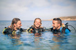 Scuba divers enjoying their excursion in the sea