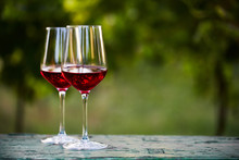 Two Glasses Of Red Wine On Table In The Vineyard