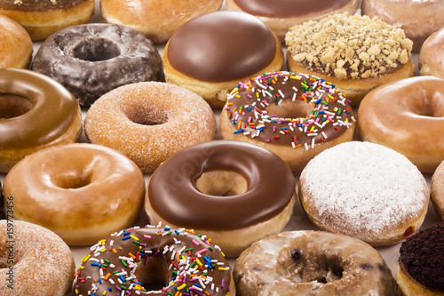 Fotomural Background of Assorted Donuts (Doughnuts) of Various Flavors