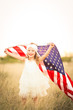 © MeganBetteridge - Adorable patriotic girl with american flag