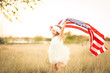 © MeganBetteridge - Adorable patriotic girl with american flag