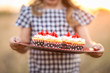 © MeganBetteridge - Patriotic girl with fourth of July cupcake