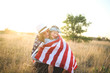 © MeganBetteridge - Patriotic mother and daughter with American flag