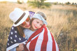 © MeganBetteridge - Patriotic mother and daughter with American flag