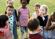 © Rawpixel.com - Group of kindergarten kids friends holding hands playing at park