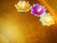 Color Filtered: Candle In The Flowers Colorful Holders Floating On Water, Temple And Mindfulness Background Concept