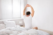 © Andrey Popov - Man Stretch His Hand After Wake Up In Bed