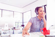 © Sergey Nivens - Portrait of smiling afro-american office worker sitting in offfice with headphones