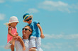 © nadezhda1906 - happy father with two kids on shoulders at sky