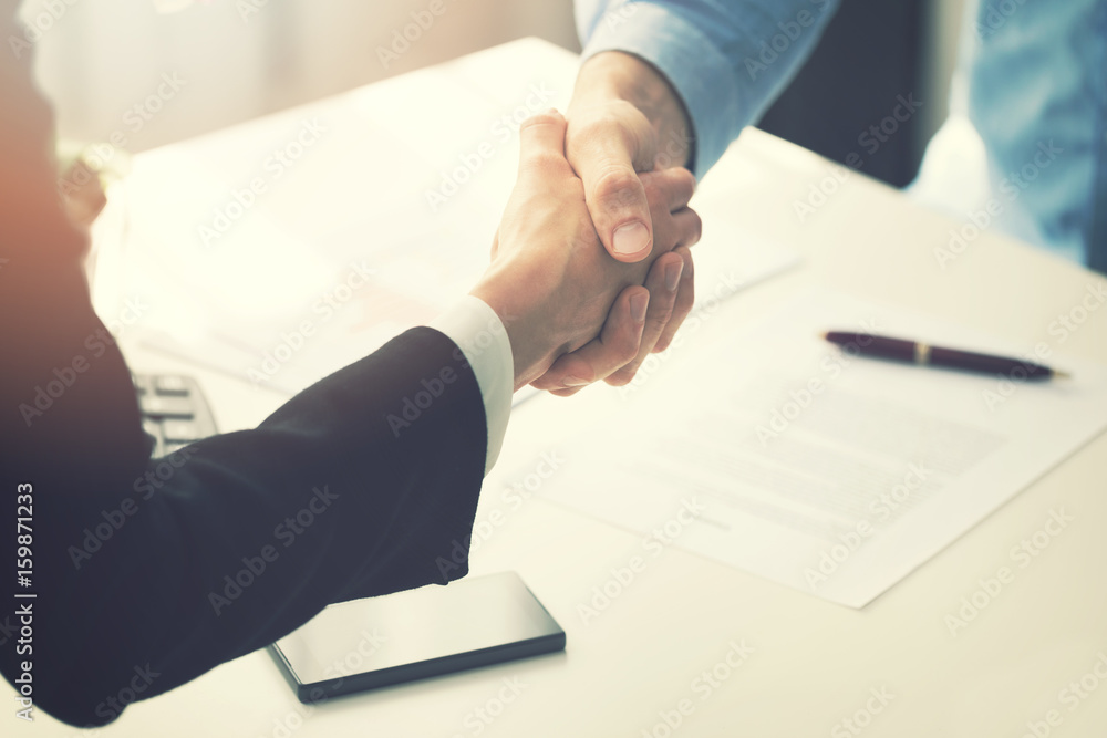 business people handshake after partnership contract signing - obrazy, fototapety, plakaty 