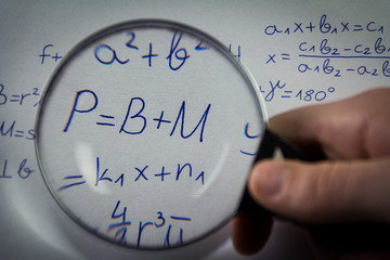 Mathematical formulas viewed through a magnifying glass