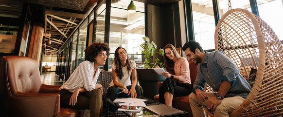 business team working on new project and smiling