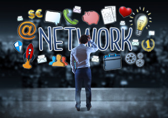 Wall Mural - Businessman watching social network sketch on a rooftop 3D rendering