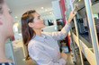 © auremar - beautiful female making coffee and cappuccino in a canteen