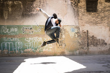Male Urban Dancer In The Air