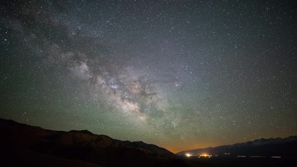 Wall Mural - the stars and milky way move across the night sky.