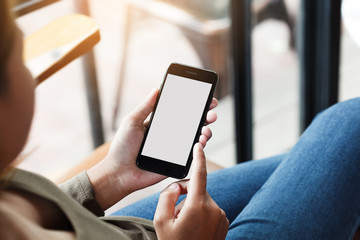 Canvas Print - female using phone show white screen display in coffee shop outdoor lifestyle